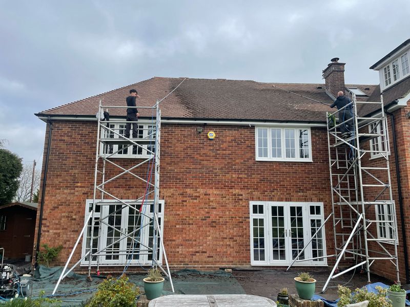 Roof cleaning carried out safely from scaffold towers by The Roof Moss Cleaners in Croxley Green